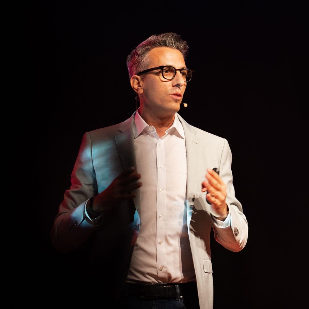 Daniel Garofoli speaking on stage